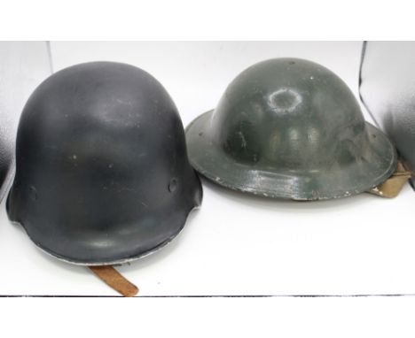 Three C1940s steel helmets, comprising a German Stahlhelm inscribed 'A. Lodenkeinper' to leather lining. Also including a Sov