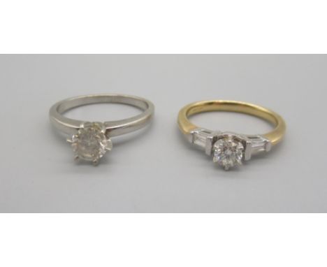 14ct yellow and white gold diamond solitaire ring, the central round cut diamond in claw mount on shoulders set with baguette