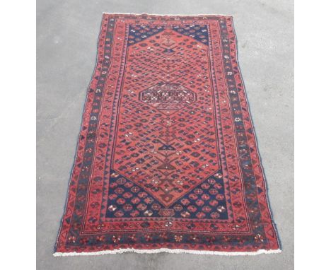 Mid 20th Century Hammadan rug, central diamond medallion in rust ground field, geometric red patterned border, L246cm x W131c