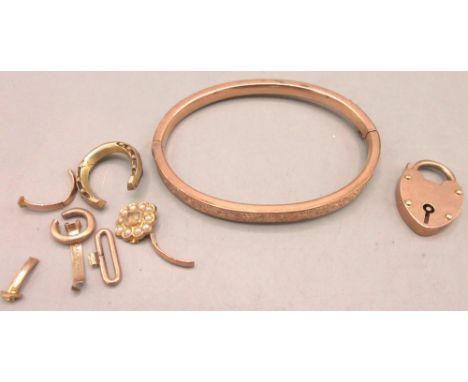9ct rose gold bangle partly engraved with foliate design, clasp stamped 9ct, D5.5cm, 9ct rose gold heart padlock, stamped 375