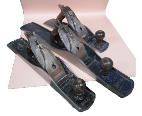 Three vintage carpentry planes, comprising a Record no. 8 jointer plane with Stanley blade; Stanley Bailey no. 6 bench plane 