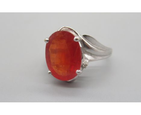 18ct white gold cocktail ring set with red sapphire, stamped 750, size N, 6.09gShipping £20.00 plus vat (UK Only)