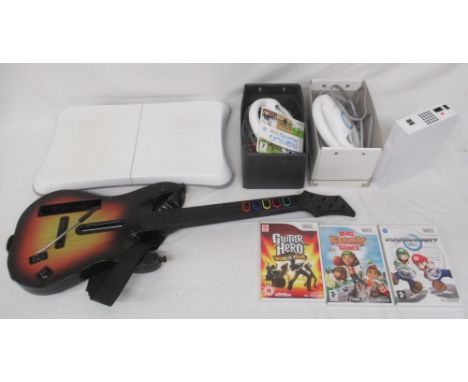 Nintendo Wii console, controllers, Guitar Hero guitar, & 3 Wii gamesShipping £48.00 plus vat (UK Only)