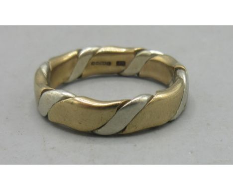 9ct yellow and white gold ring, stamped 375, size R, 6.50gShipping £20.00 plus vat (UK Only)
