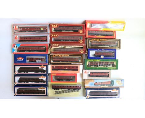 Twenty two boxed OO gauge mostly BR maroon railway coaches from Hornby, Lima, Mainline, Airfix, Bachmann and Hachette includi