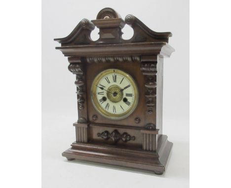 H.A.C. beech mantle clock, carved and moulded case with brass bezel enclosing 4" dial with enamel Roman chapter ring, signed 
