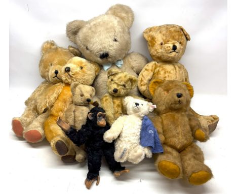 Steiff 'Ocean' bear, white mohair, white tag No. 660801, H23cm; large Merrythought Bear, in white mohair with a blue ribbon a