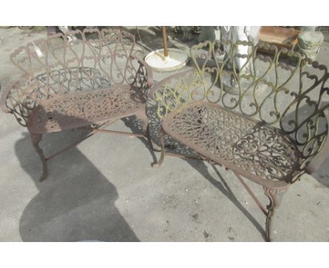 Pair of cast metal openwork garden bench seats, with heart pierced backs on curved supports with stretchers, W95cm D50cm H83c