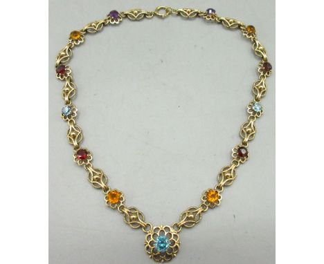 9ct yellow gold fancy link chain necklace set with multi-coloured gem stones in flower shaped links, light blue stones test a