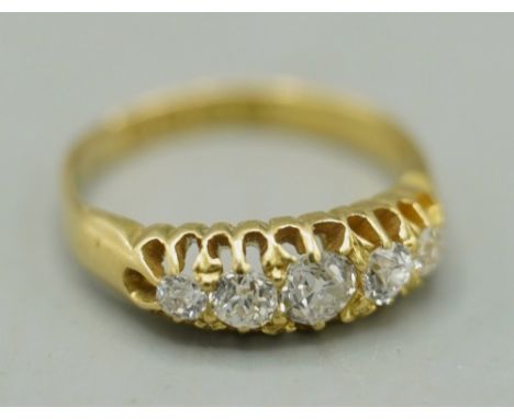Victorian style 18ct yellow gold boat ring, set with five old cut diamonds, stamped 18, size K, 3.09gShipping £20.00 plus vat
