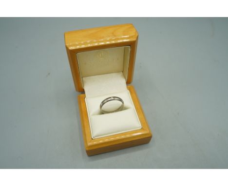 18ct white gold ring in set with small diamonds, stamped 750, size R, 4.27g, boxedShipping £23.00 plus vat (UK Only)