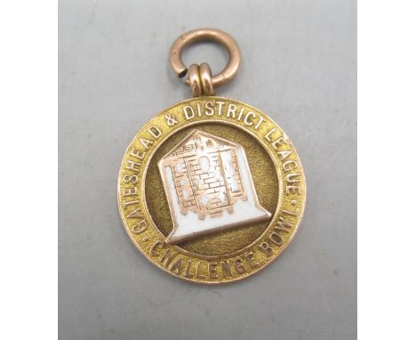9ct yellow gold and enamel fob for Gateshead  & District Challenge Bowl League, stamped 375, 6.69gShipping £20.00 plus vat (U
