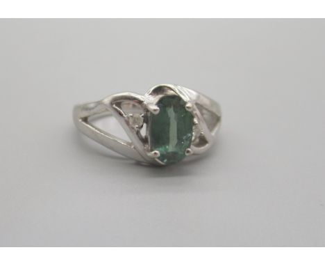 18ct white gold ring set green stone in ornate mount, stamped 750, size N1/2, 5.55gShipping £20.00 plus vat (UK Only)