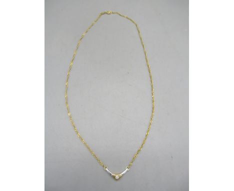 18ct yellow and white gold necklace with arrow head shaped pendant set with single diamond, stamped 750, 45cm, 4.67gShipping 