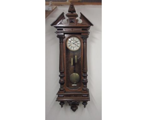 19th Century Continental figured walnut Vienna wall clock, architectural pediment over full length glazed panel door flanked 