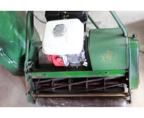 Atco ride on grounds man petrol lawn mower, with cylinder cutter, roller to front and back of seat, and grass boxShipping POA