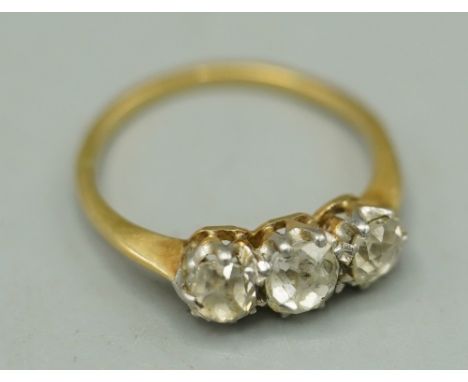 Unmarked yellow metal three stone diamond ring, size K, 2.3g Shipping £20.00 plus vat (UK Only)