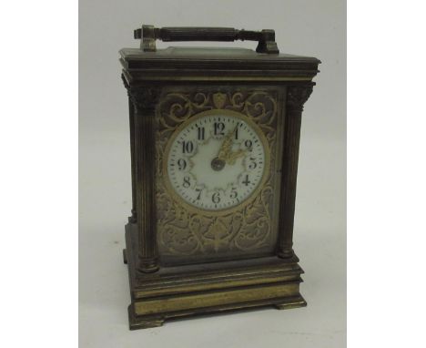 19th Century French 8 day brass carriage clock, the case with Corinthian columns, 2 1/4" cream enamel Arabic dial decorated w