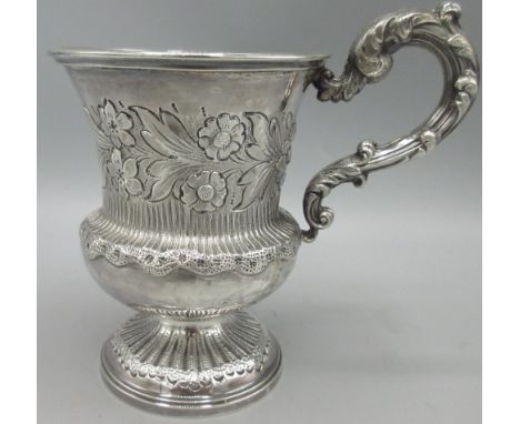 William IV silver christening mug, flared baluster form body, foliate repousse, acanthus leaf scrolled handle, and gilt inter
