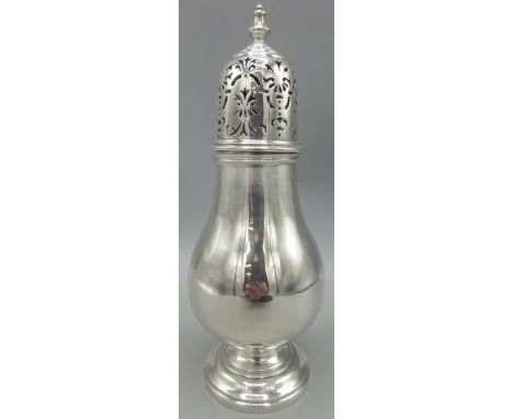 20th century silver sugar caster of baluster form on raised pedestal foot, pierced top with urn shaped finial by Joseph Glost