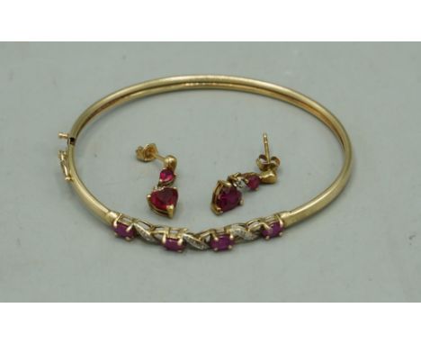 Yellow gold bangle set with rubies and diamonds, AF, stamped 8k, and a pair of 9ct yellow gold drop earrings set with heart s