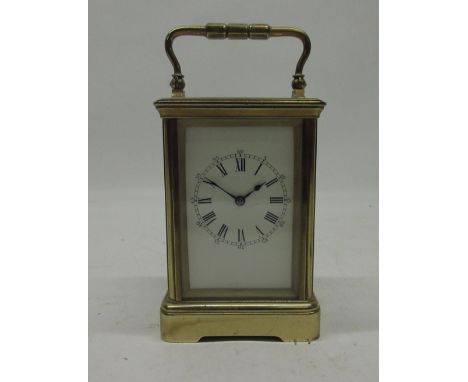 Paris, early 20th Century French 8 day brass carriage clock, gorge case with carrying handle, white enamel Roman dial, signed