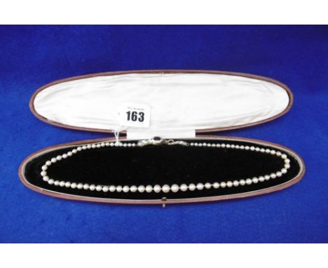 A FRENCH ART NOUVEAU NATURAL PEARL NECKLACE WITH 18CT AND CLOSSONIE SERPENT CLASP SET WITH GEM STONES, GARNET A/F 