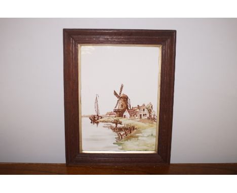 A framed tile depicting a windmill 