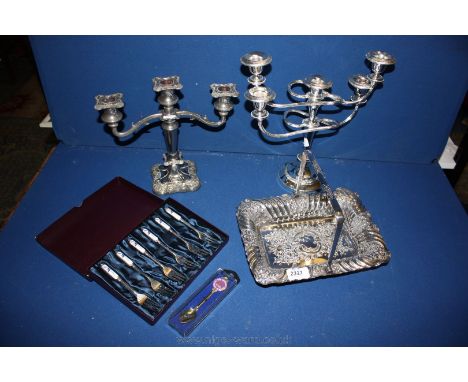 A five branch and a three branch plated Candelabra together with other plated items including bread basket.