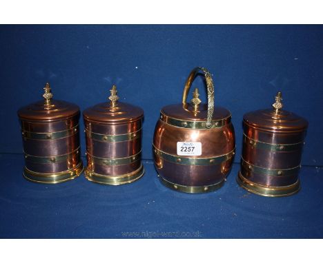A Copper and brass Tea Caddy and three Canisters