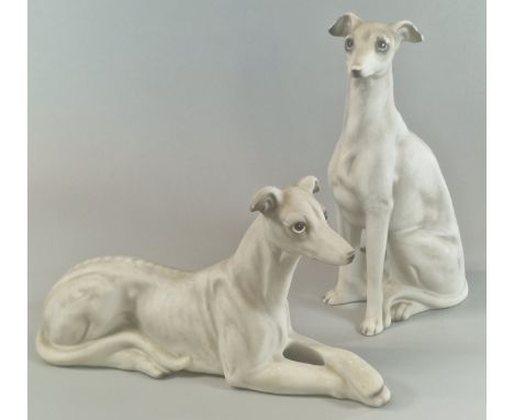 Two similar Continental porcelain Blanc de Chine studies of Greyhounds/Whippets in recumbent and seated poses, possibly by Ro