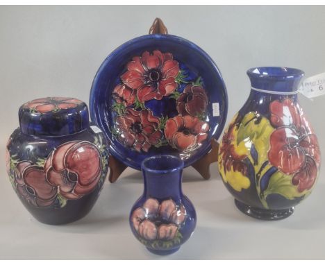 Collection of Moorcroft Pottery tube-lined items, in the 'Anemone' pattern to include: two baluster vases, cabinet plate and 