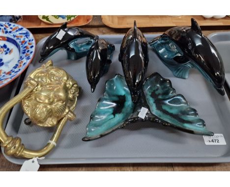 Brass door knocker in the form of a female Lion. Together with Group of various Poole Pottery china Dolphins, together with a