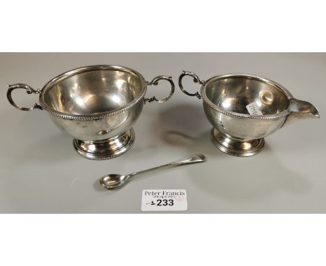 A matching silver two-handled sucrier and cream jug together with a small silver spoon. Birmingham hallmarks. Total weight 7 