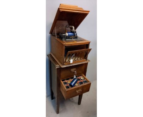 Edison oak cased phonograph, together with a stained pine chest of three drawers containing a large collection of Amberola ph