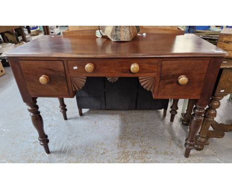 Victorian mahogany side table, having moulded edge top over three drawers with fan moulded angles on baluster turned tapering