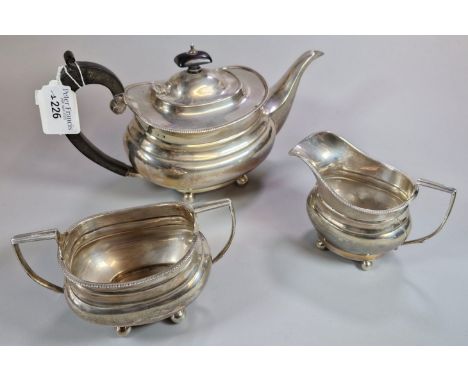 A silver three-piece tea service. Birmingham hallmarks. 25 troy oz approx. (B.P. 21% + VAT)