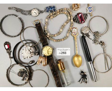 Tub of oddments to include: various bangles, Vertex ladies' wristwatch, brooch in the form of a Fawn, souvenir spoon, brooche