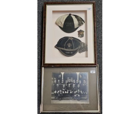Two framed and mounted 1920s Rugby Football caps, the bottom cap marked Leytonstone, together with blazer badge, in one frame