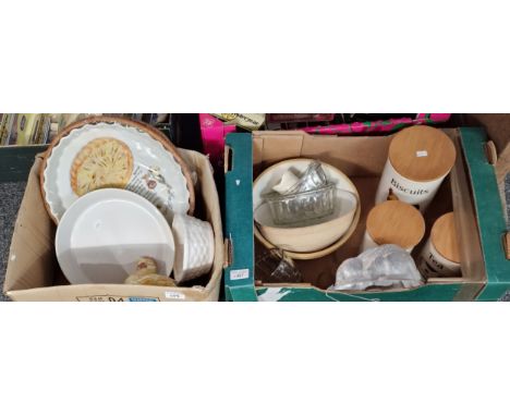 Two boxes of kitchenalia to include: egg crock, biscuit, tea and sugar canisters, stoneware mixing bowls, glass jelly moulds 