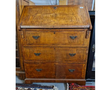 Early 20th century walnut fall front bureau with three long drawers on bracket feet. (B.P. 21% + VAT)