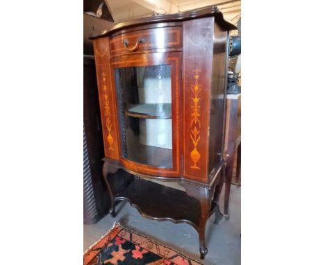 Edwardian inlaid mahogany bow fronted single display cabinet with frieze drawer and under-tier. 66cm wide approx.  (B.P. 21% 