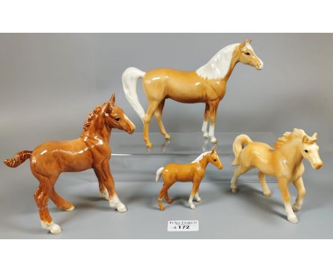Three Beswick horses and foals to include Palomino and another ceramic horse study. (4) (B.P. 21% + VAT).Ceramic unmarked hor