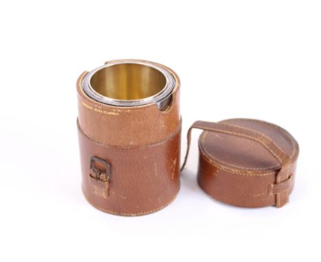 A set of electro plated graduated travelling cups, by Hukin & Heath, contained in a leather carrying case