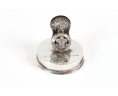 A silver Welsh Fusilier's menu holder, by the Goldsmiths and Silversmiths Co. London 1916