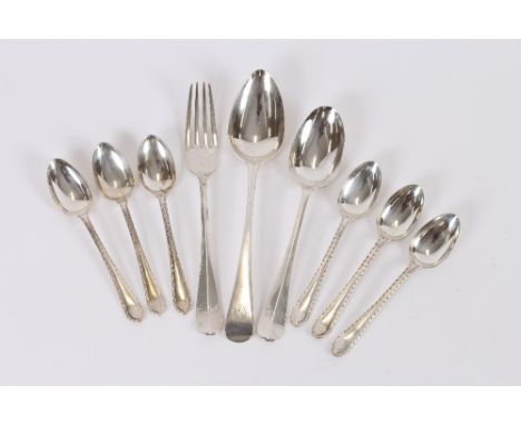 A set of six George V silver feather edged teaspoons, Sheffield 1931; a Georgian silver dessert spoon, London 1814, (monogram