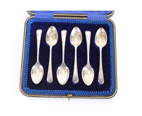 A cased set of six silver teaspoons, having foliate engraved borders, Sheffield 1911