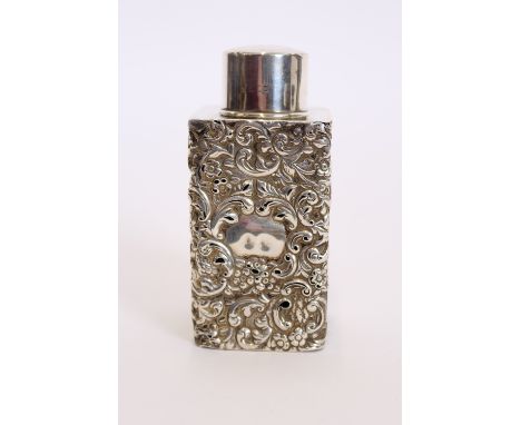 An Edwardian silver caddy shaped jar, probably by Nathan & Hayes, of straight sided square section, embossed with flowers and