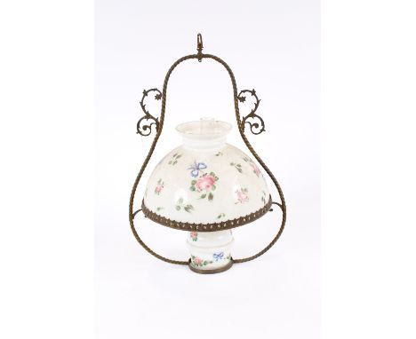 A Victorian hanging ceiling oil lamp, with floral garland and ribbon decorated opaque shade and reservoir