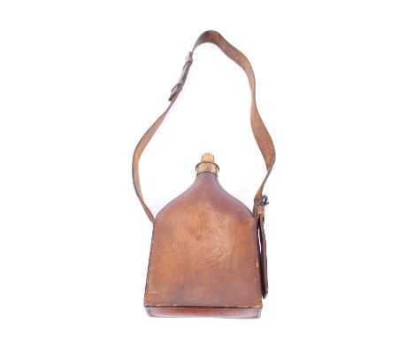 A large 19th Century leather powder flask, with screw hinged top and carrying strap, 37cm